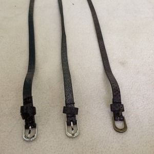 three fashionable, unique skinny black belts