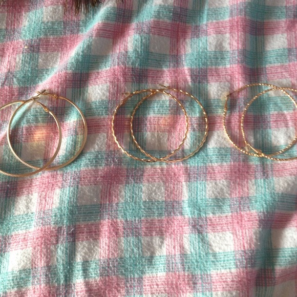 3 pairs of gold hoop earrings