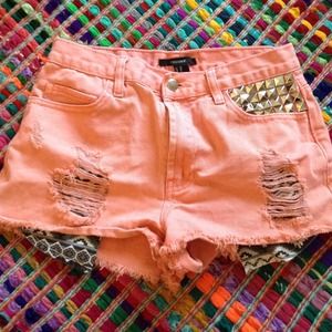 Pink studded and distressed high waisted shorts