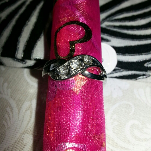 silver toned ring with cubic zirconia