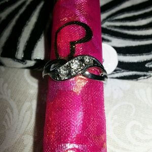 silver toned ring with cubic zirconia