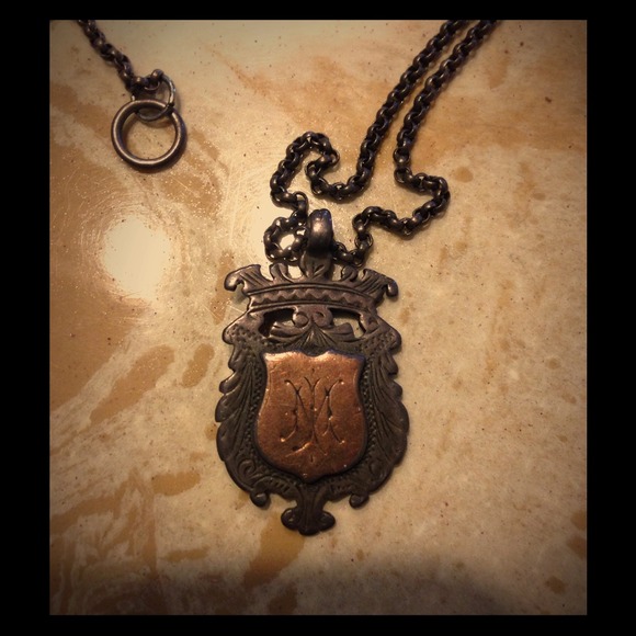 Vintage crest from a pocket watch now a charm