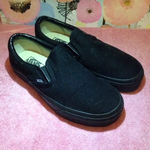 NEW. all black slip on vans