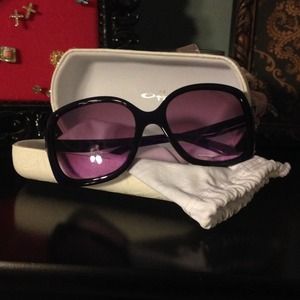 Plum-colored Oakley sunglasses