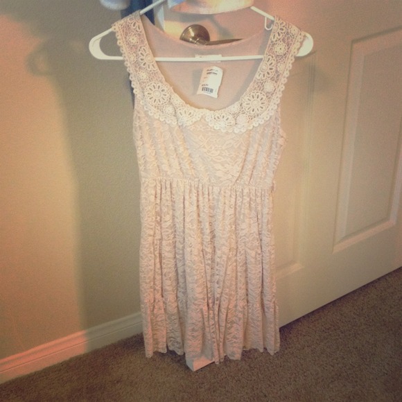 A light pink/nude flowey mini dress