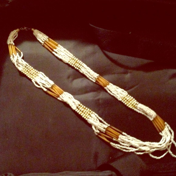 White beaded necklace with gold bead accents