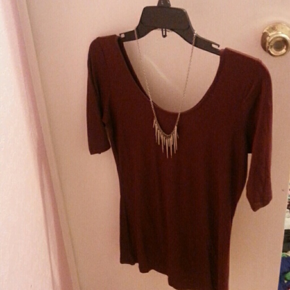 Dark red shirt with smokey necklace