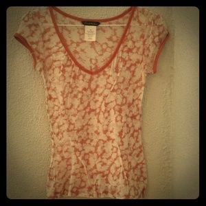 Sheer burnt orange top.