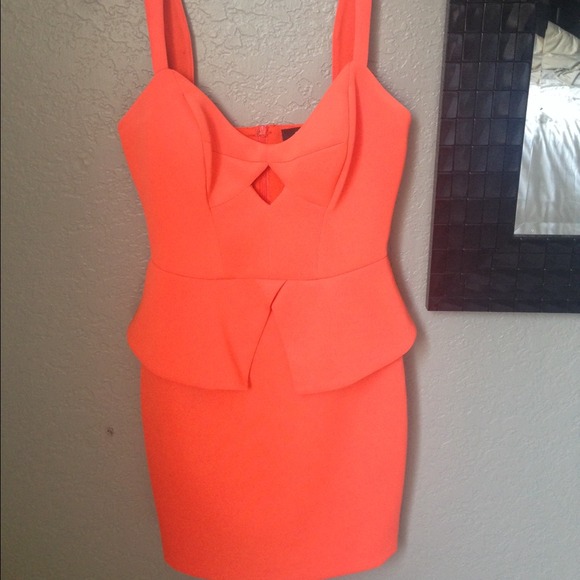 Orange peplum-like dress.