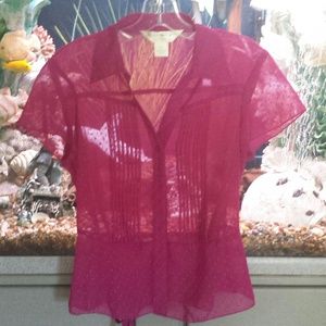 100% polyester. ..see threw blouse