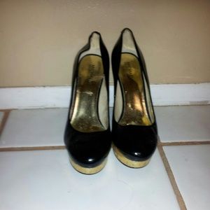 Michael Kors black and gold pumps