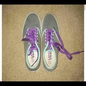 Gray and blue vans with purple laces