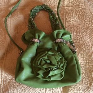 Elegant green purse with flower
