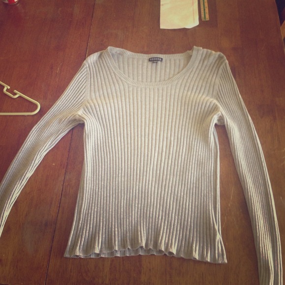 A George sweater. Runs very small about a medium.