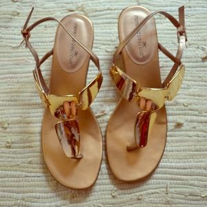 Gold wedged gladiator shoes