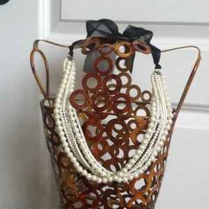 Pearl necklace with black ribbon tie