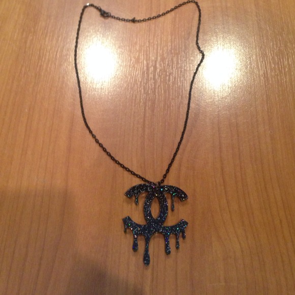 Plastic Chanel drip necklace. Not authentic