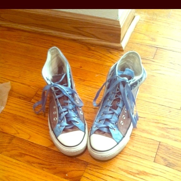 Layered converse tennis shoes.