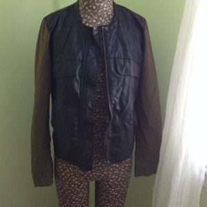 Vegan leather jacket with green sleeves