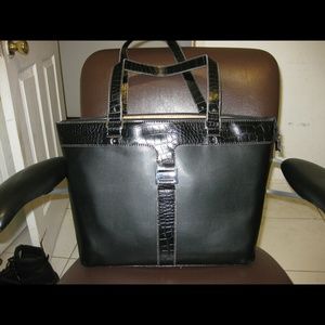 Black handbag manmade durable material