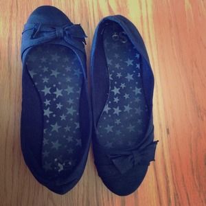 Black flats with a bow