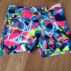 Bright neon underarmour compression shorts