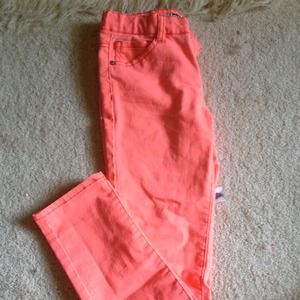 bright coral colored denim skinny jeans