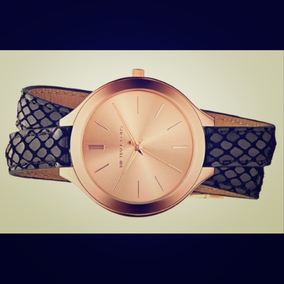 Michael Kors embossed leather strap watch.