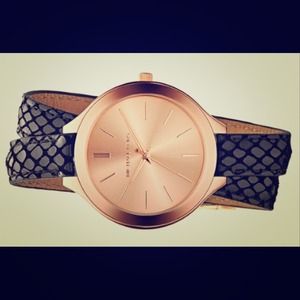 Michael Kors embossed leather strap watch.