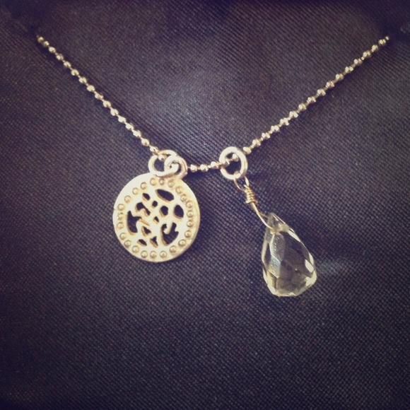 Asian lettering pendant with clear gemstone