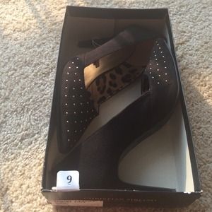 Gold studded black heel