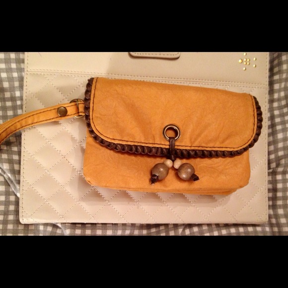 Faux leather wristlet.
