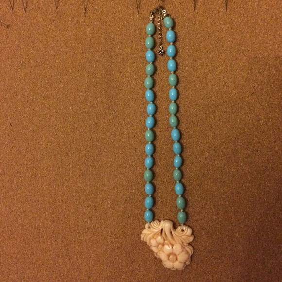Pastel blue beaded necklace with floral center
