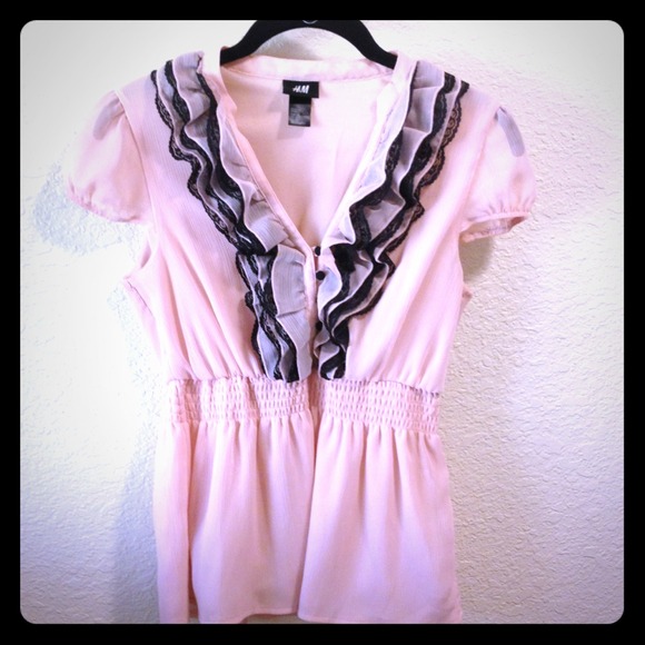 Blush pink H&M ruffled blouse with black lace trim