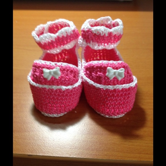 Pink and white infant shoes.