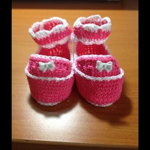 Pink and white infant shoes.