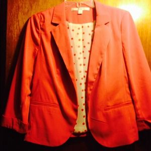 Salmon pink blazer.