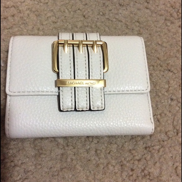 White Michael Kors buckle trifold Wallet.