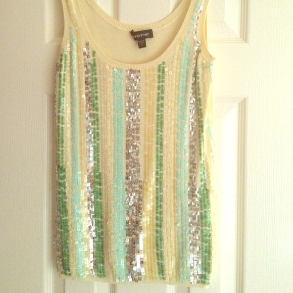 Very worn. Strings pulled, slight stain on back.