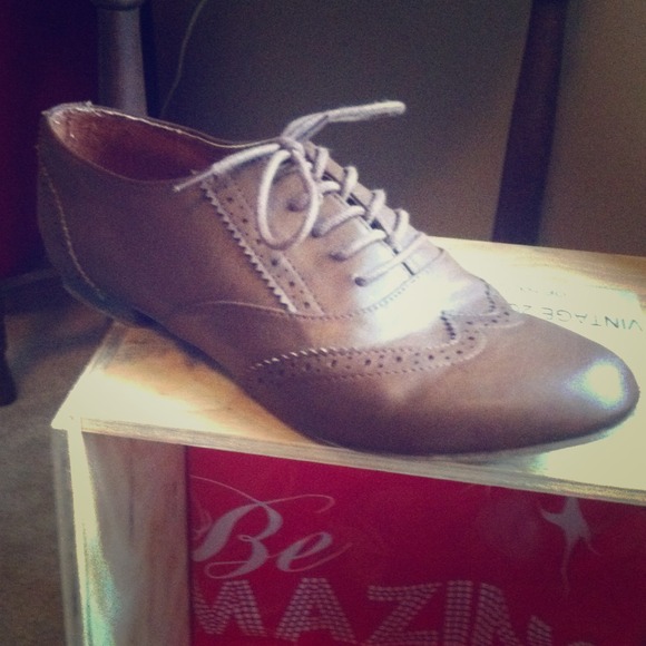 Brown wingtip styled women's shoe