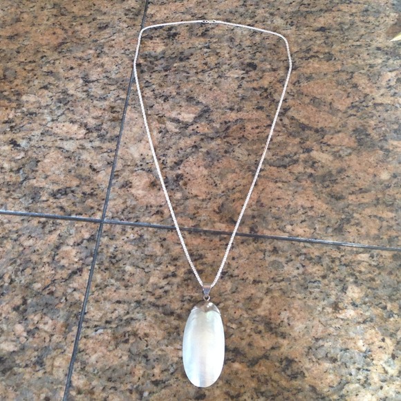 Long necklace with shell enhancer