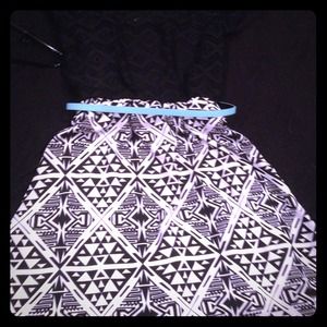 A knee length dress with a light blue belt