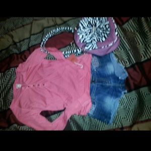 Shirt pink with little black dots all over it