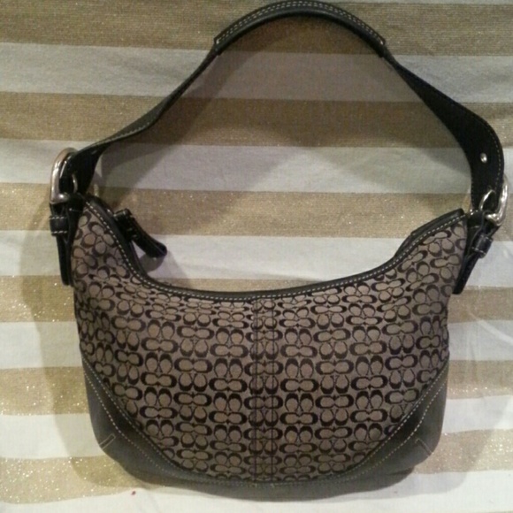 Coach purse with buckle accents