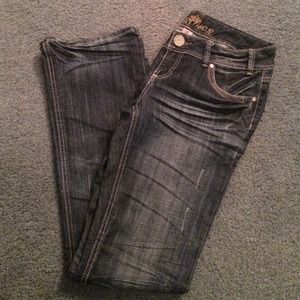 Almost famous medium/dark wash destressed jean!