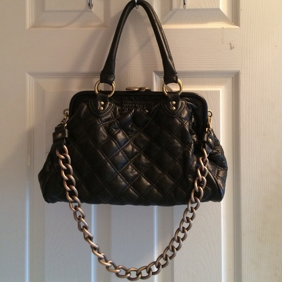 Black handbag with removable gold chain