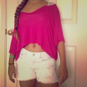 Fuchsia cropped top with a lace panel in the back.