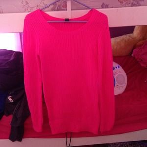 A pink long sweater.