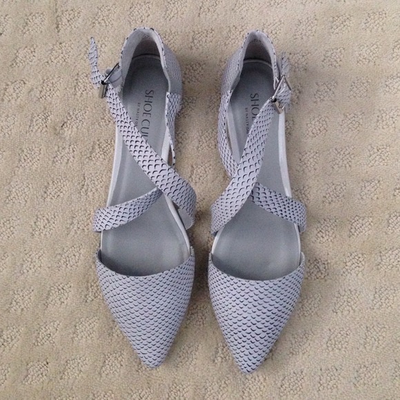 White flats with scale design