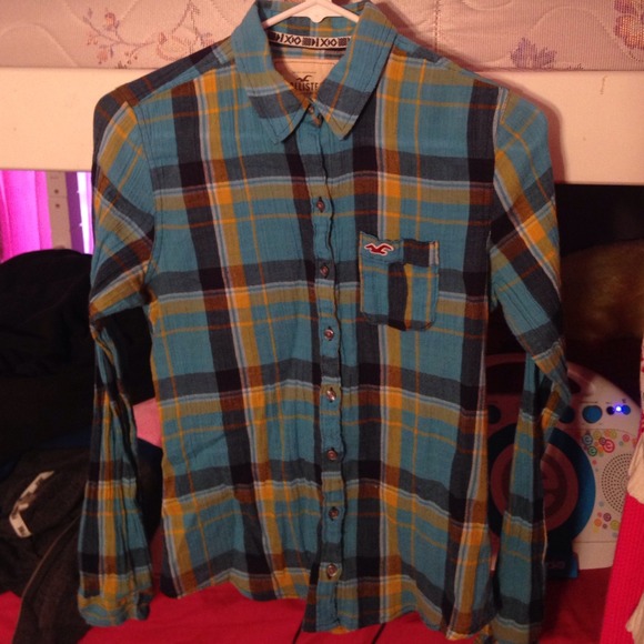 Mainly blue plaid shirt.